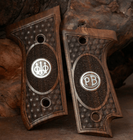 Beretta 92S grips made of walnut wood with custom logos made of silver.