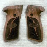 Sig Sauer P229 custom walnut wood grips with engraved logo, designed for upgraded firearm comfort and style.