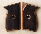 Sig Sauer P230 custom walnut wood grips with detailed grain pattern and ergonomic design for enhanced pistol handling.